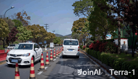 JoinAI Terra generated video frame showing a daytime road scene 3 with traffic cones on a sunny day.